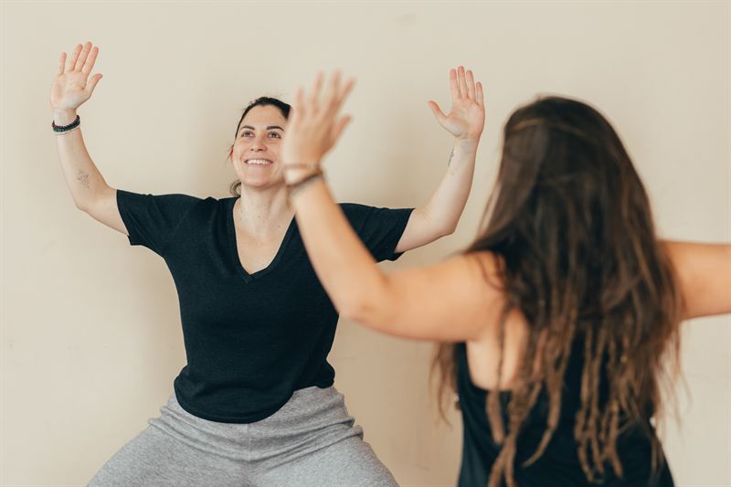 Pauline and a student laughing during an adjustment