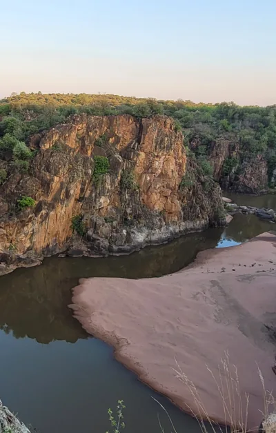 A river winding at the foot of the Panorama Route cliffs